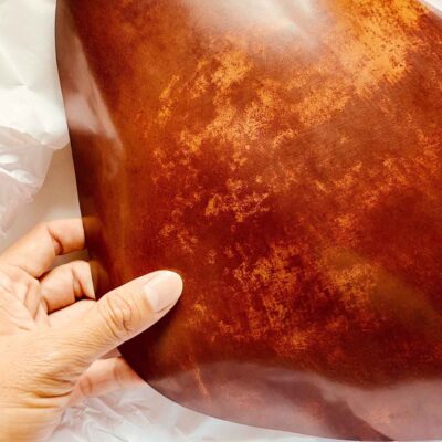 Shell cordovan leather showing its smooth surface and distinctive natural character
