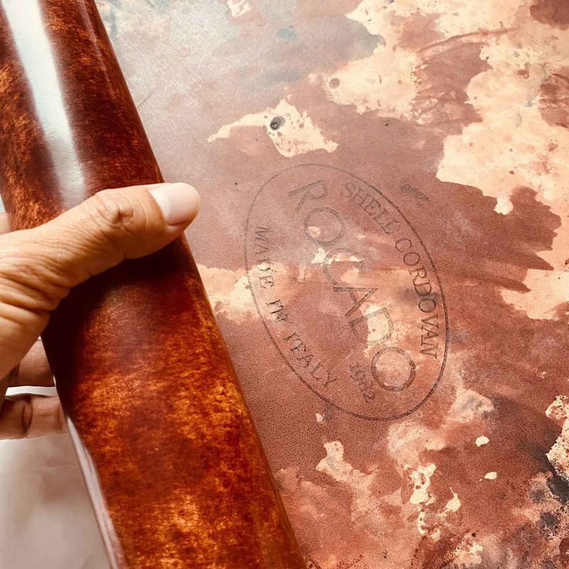 Close-up detail of the smooth surface of shell cordovan leather